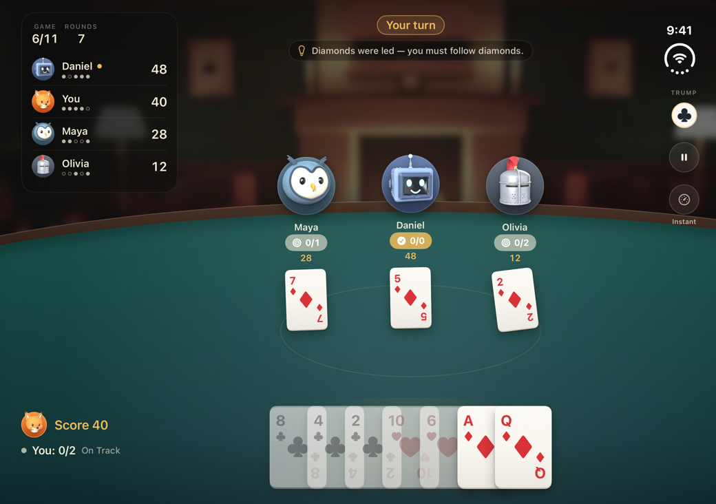 The unfolded iPhone Duo mid-trick: the scoreboard at top left, the owl, robot and knight across a wide table, three diamonds played, trump and pause along the right edge, and your hand below.